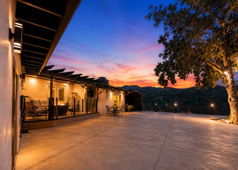 Spacious outdoor terrace with mountain sunset view
